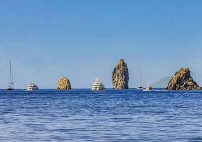 Scenic view of sea against clear blue sky
