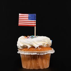 Close-up of chocolate cake against black background