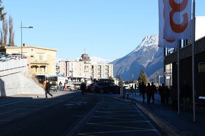 People walking on road in city