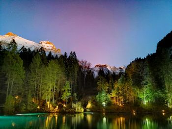 Scenic view of lake and mountains against clear sky