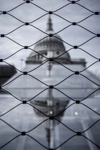 Full frame shot of chainlink fence against sky