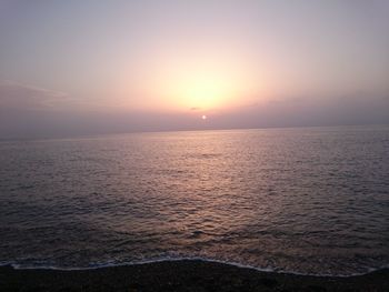 Scenic view of sea at sunset