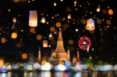 Defocused image of illuminated building at night