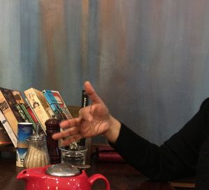 Midsection of man using mobile phone