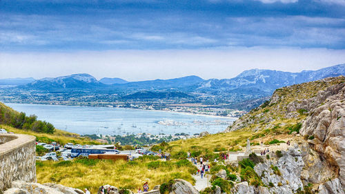 Scenic view of mountains against cloudy sky