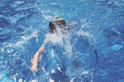 High angle view of man swimming in pool