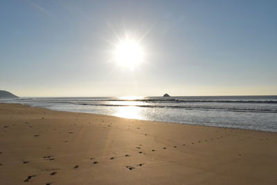 Scenic view of beach against clear sky