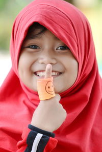 Close-up portrait of a smiling girl