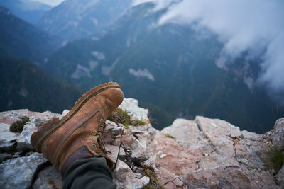 Low section of person on rock