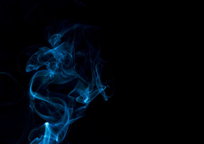 Close-up of smoke against black background