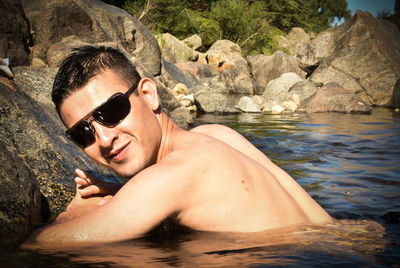 Portrait of young man in water