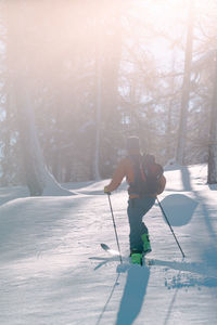 Backcountry skier going uphill in deep snow