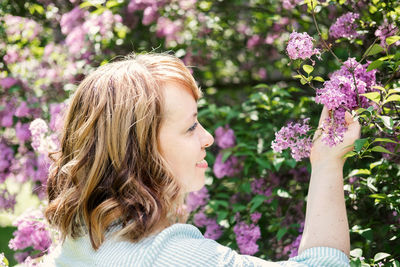 Portrait of woman with pink flowers