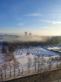 High angle view of city buildings during winter