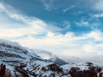 Scenic view of snowcapped mountains against sky