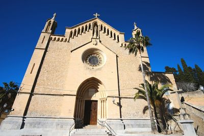 Low angle view of cathedral against clear blue sky