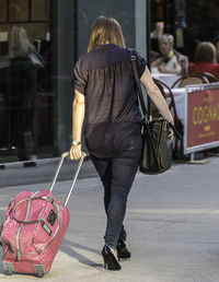 Rear view of woman walking outdoors