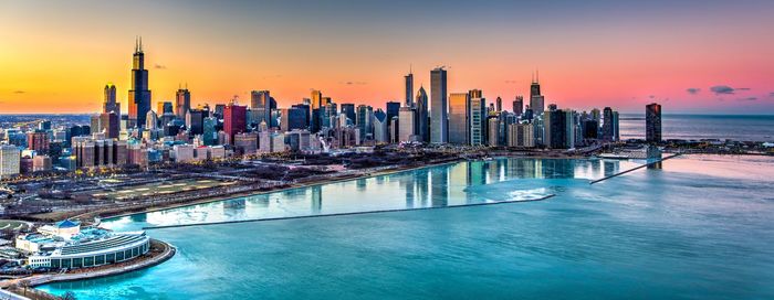 Panoramic view of buildings against sky during sunset