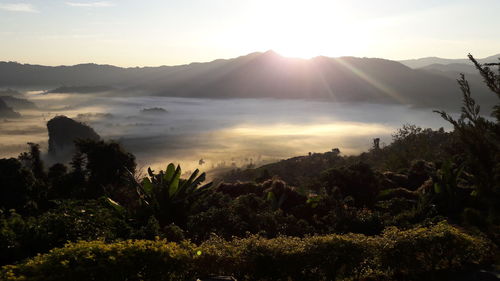 Scenic view of mountains against sky during sunset