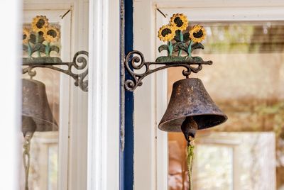 Close-up of bell hanging on wall