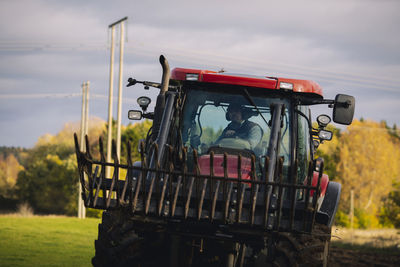 Farmer driving tractor