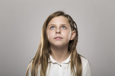 Portrait of girl against white background