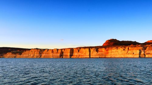 Scenic view of blue sea against clear sky