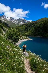 Scenic view of lake against cloudy sky