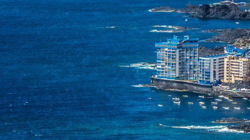 High angle view of sea against blue sky