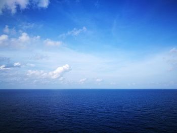 Scenic view of sea against blue sky