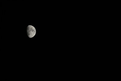 Low angle view of moon against sky at night
