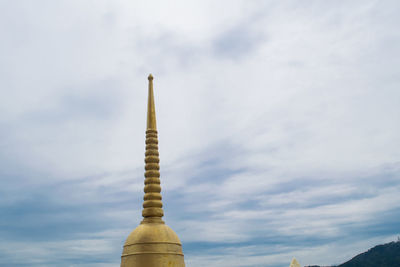 Low angle view of bell tower against sky