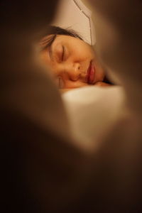 Portrait of girl sleeping on bed