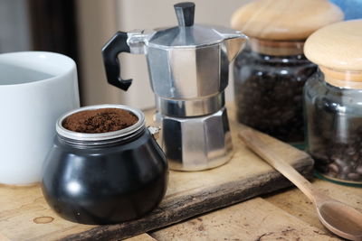 Close-up of coffee cups on table