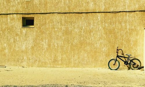 Bicycle against brick wall