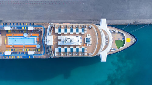 Aerial view of cruise ship moored at harbor