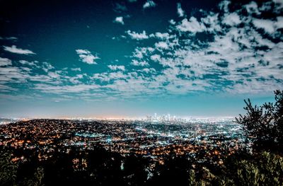 Aerial view of cityscape against sky