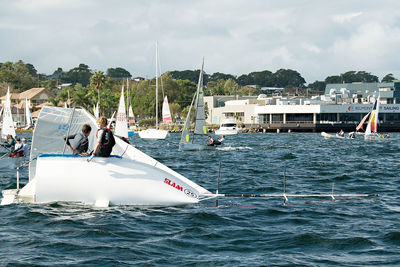 Boats sailing in sea against sky