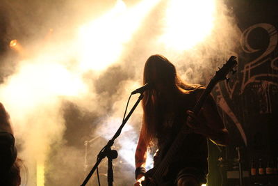 Silhouette of people in music concert