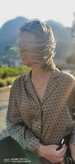 Midsection of woman looking at camera