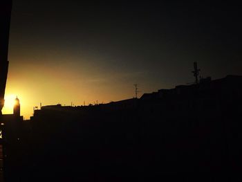 Low angle view of built structure at sunset