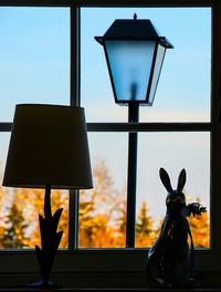 Lamp post against sky at night