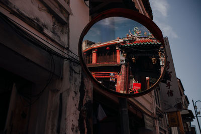 Low angle view of old building against sky