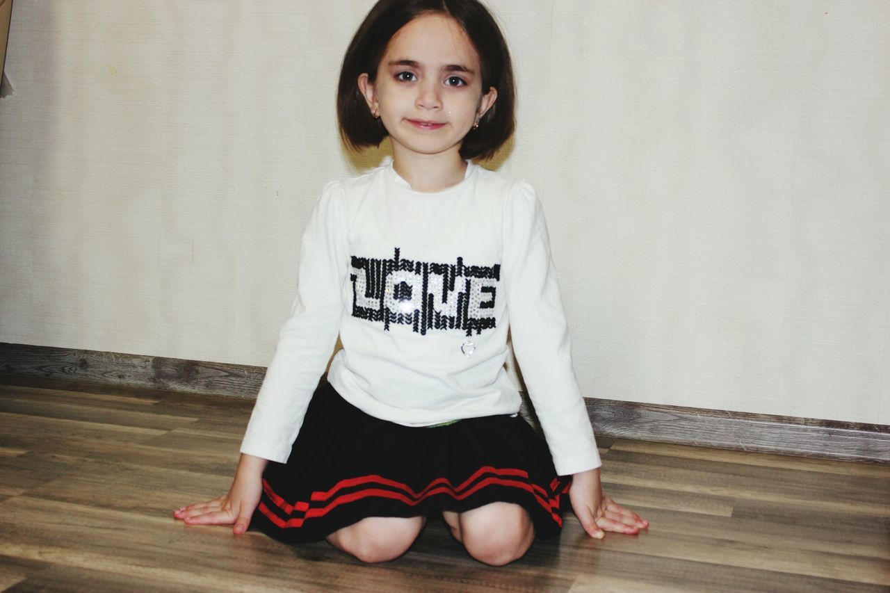 portrait, looking at camera, full length, children only, indoors, one girl only, smiling, text, childhood, one person, people, day