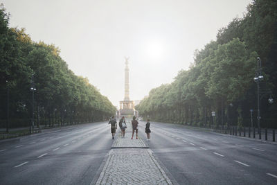 People walking on road in city