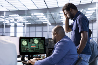 Side view of man working in office