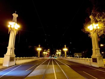 Illuminated street lights at night