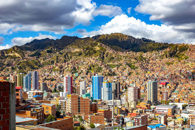 High angle view of buildings in city against sky