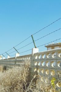 Low angle view of built structure against clear blue sky