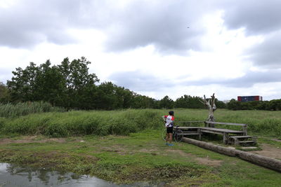 Man on field against sky